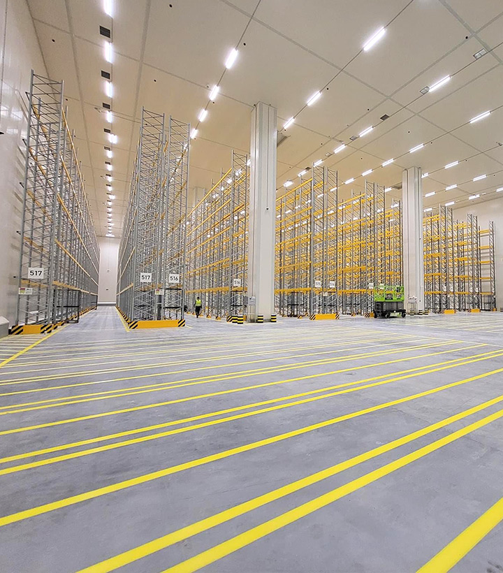 Workers finalize the concrete floor by applying a layer of ferroconcrete.